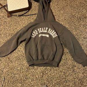 Selling a gray hoodie for girls sized medium youth from Camp Seale Harris.